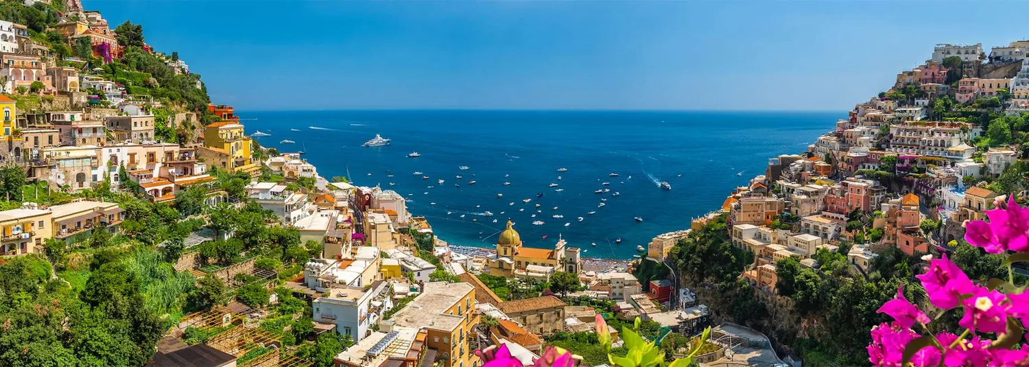 The cliffs and pastel houses of the Amalfi Coast above the sea