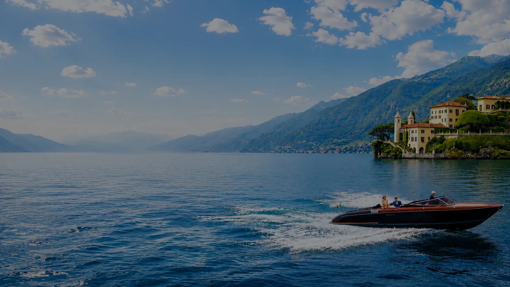 Luxury wooden boat on dark waters, aerial view
