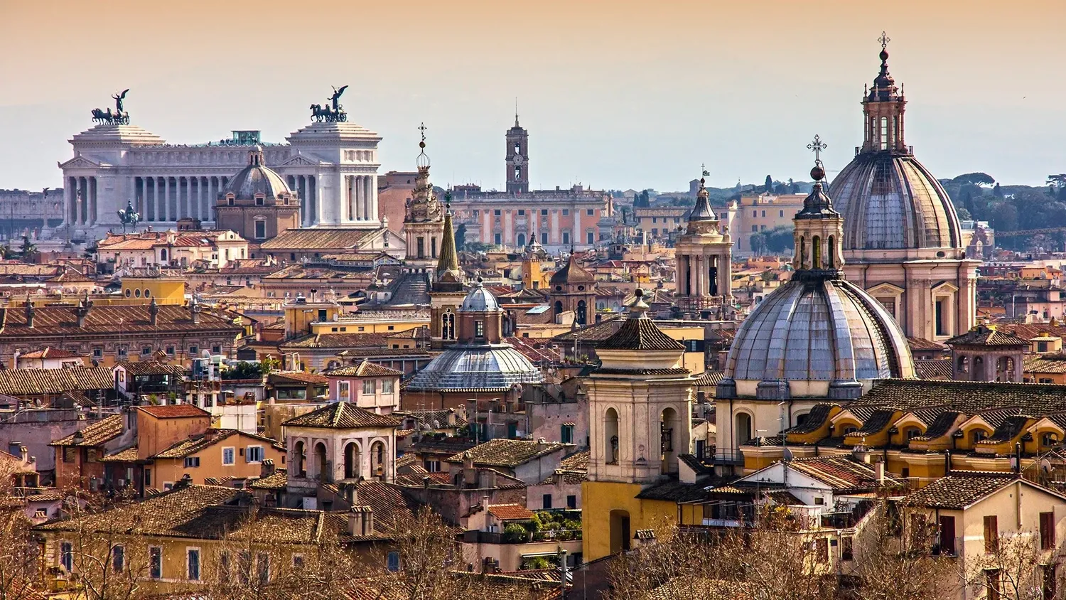Golden light over the domes and rooftops of Rome